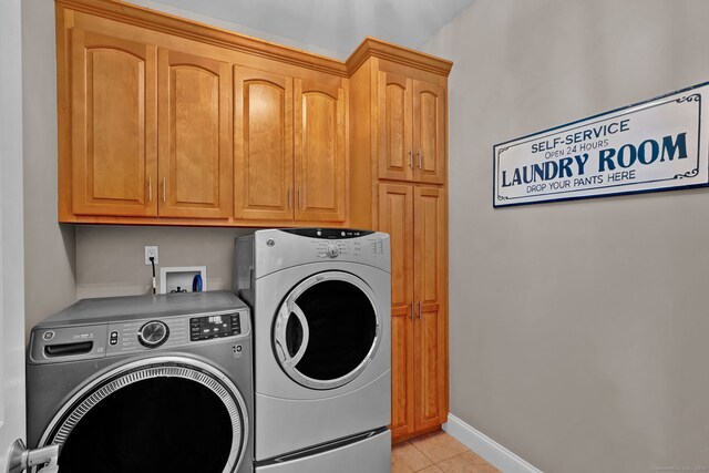 18 Cedar Spring Rd, Burlington, CT 06013 - laundry area featuring cabinet space, washing machine and clothes dryer, light tile patterned floors, and baseboards