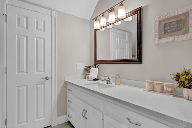 18 Cedar Spring Rd, Burlington, CT 06013 - bathroom with vanity, tile patterned flooring, vaulted ceiling, and baseboards