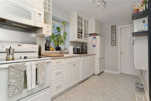 21 Hubbard Rd Apt 1, Wilton, CT 06897 - kitchen featuring white appliances, white cabinets, glass insert cabinets, and open shelves