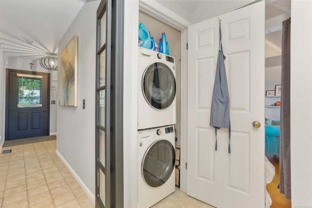 21 Hubbard Rd Apt 1, Wilton, CT 06897 - laundry room featuring stacked washer / drying machine and light tile patterned floors