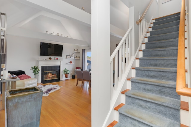21 Hubbard Rd Apt 1, Wilton, CT 06897 - stairs with wood finished floors, a fireplace, and lofted ceiling