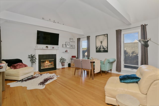 21 Hubbard Rd Apt 1, Wilton, CT 06897 - living area with healthy amount of natural light, light wood-type flooring, a tile fireplace, and high vaulted ceiling