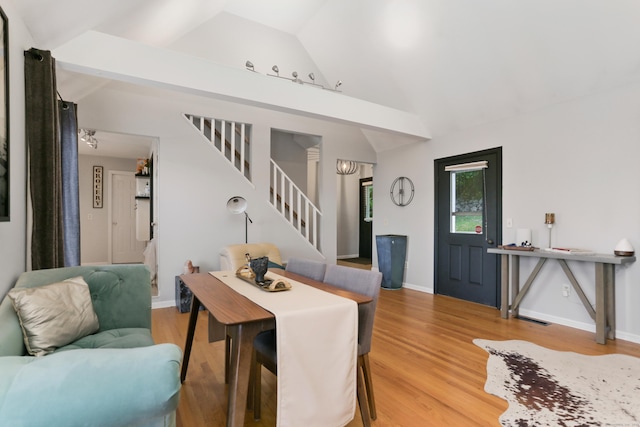 21 Hubbard Rd Apt 1, Wilton, CT 06897 - living area with stairs, vaulted ceiling, and light wood-style flooring