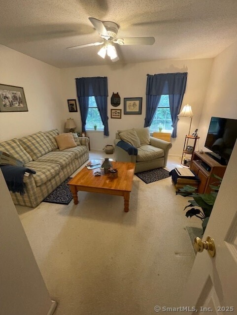 27 Shares Ln Unit 27, South Windsor, CT 06074 - living room featuring a textured ceiling, ceiling fan, and carpet