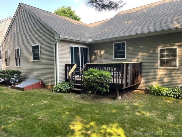 27 Shares Ln Unit 27, South Windsor, CT 06074 - back of property with a deck, a lawn, and a shingled roof