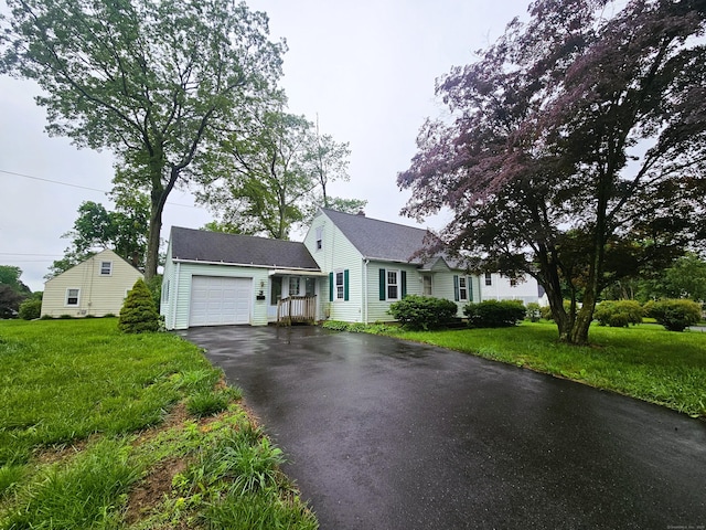 157 Garfield Rd, Bristol, CT 06010 - view of front of property with driveway, a garage, and a front yard