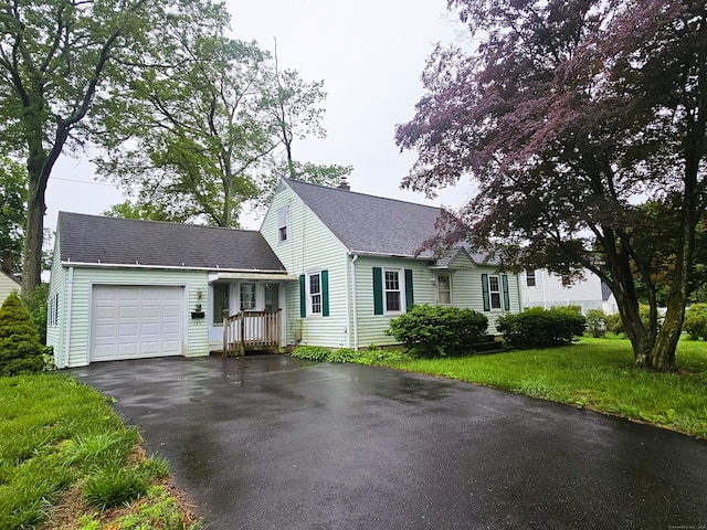 157 Garfield Rd, Bristol, CT 06010 - view of front of property featuring driveway, a garage, a shingled roof, and a chimney