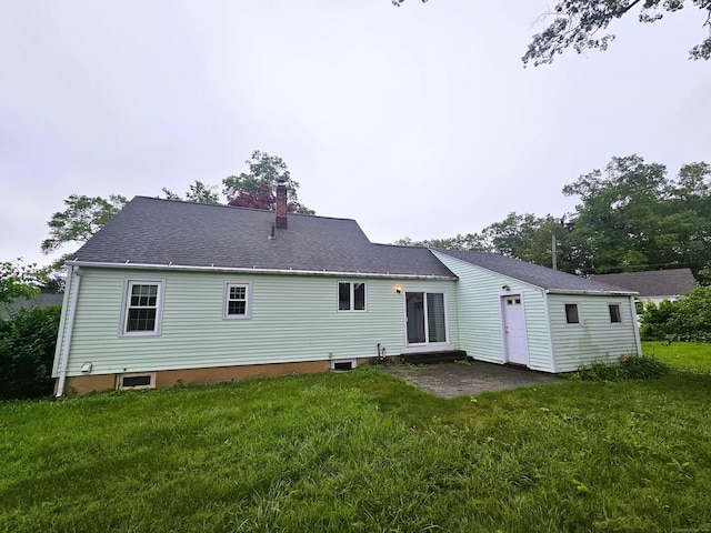 157 Garfield Rd, Bristol, CT 06010 - rear view of house with a chimney, a yard, and a shingled roof
