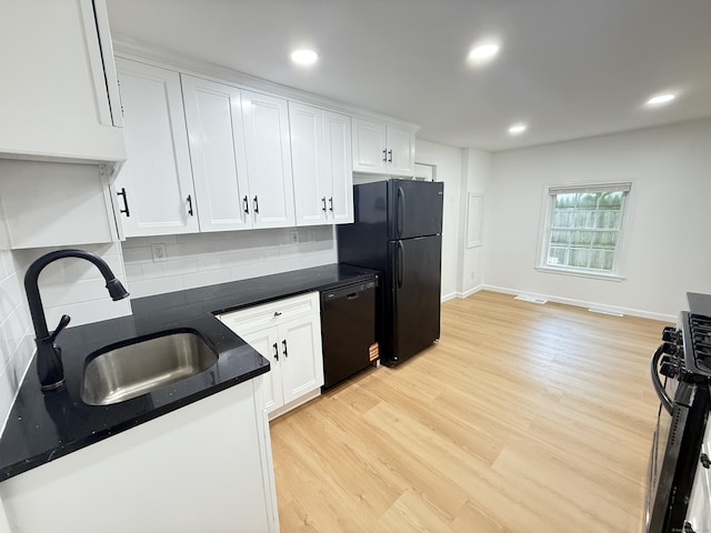 53 Cosey Beach Rd, East Haven, CT 06512 - kitchen with black appliances, light wood finished floors, white cabinets, a sink, and recessed lighting