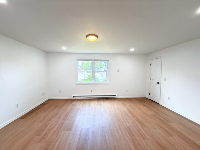 53 Cosey Beach Rd, East Haven, CT 06512 - empty room featuring a baseboard radiator, light wood-type flooring, baseboards, and recessed lighting