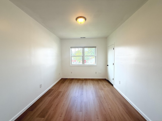 53 Cosey Beach Rd, East Haven, CT 06512 - empty room with wood finished floors and baseboards