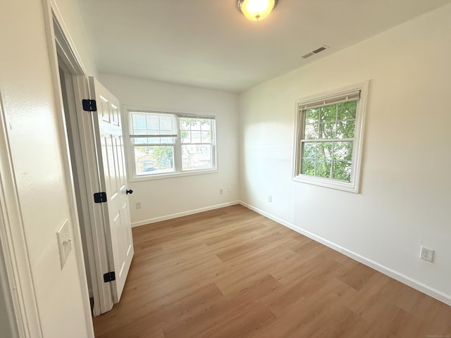53 Cosey Beach Rd, East Haven, CT 06512 - spare room with plenty of natural light, light wood-style floors, and baseboards