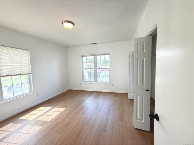 53 Cosey Beach Rd, East Haven, CT 06512 - unfurnished room featuring wood finished floors and baseboards