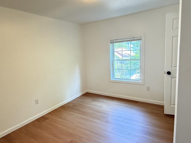 53 Cosey Beach Rd, East Haven, CT 06512 - spare room featuring wood finished floors and baseboards