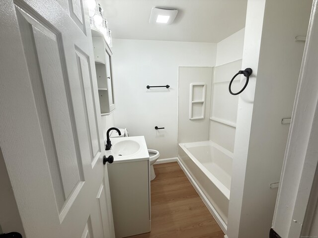 53 Cosey Beach Rd, East Haven, CT 06512 - bathroom with vanity, toilet, wood finished floors, a bathtub, and a shower