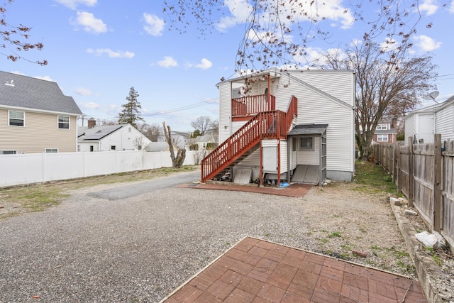 72 Maple St, Norwalk, CT 06850 - back of property featuring a fenced backyard and a residential view