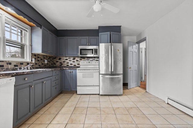 72 Maple St, Norwalk, CT 06850 - kitchen with stainless steel appliances, a baseboard radiator, tasteful backsplash, light tile patterned floors, and a ceiling fan