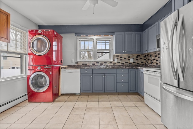 72 Maple St, Norwalk, CT 06850 - laundry room with estacked washer and dryer, a ceiling fan, a baseboard heating unit, and light tile patterned floors