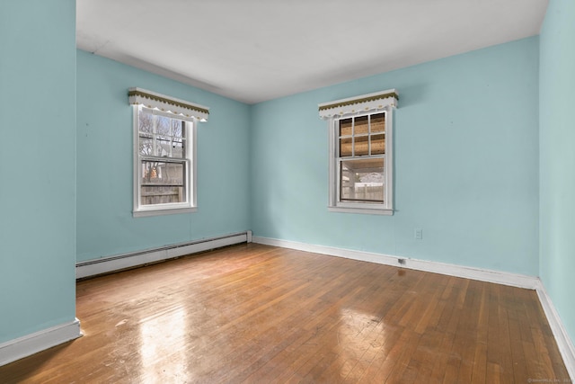72 Maple St, Norwalk, CT 06850 - empty room featuring baseboard heating and wood-type flooring