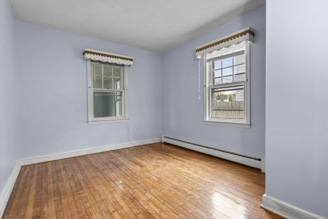 72 Maple St, Norwalk, CT 06850 - spare room featuring baseboard heating and hardwood / wood-style flooring