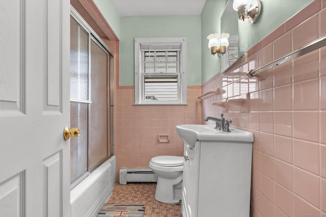 72 Maple St, Norwalk, CT 06850 - full bathroom featuring a baseboard radiator, vanity, tile walls, bath / shower combo with glass door, and wainscoting