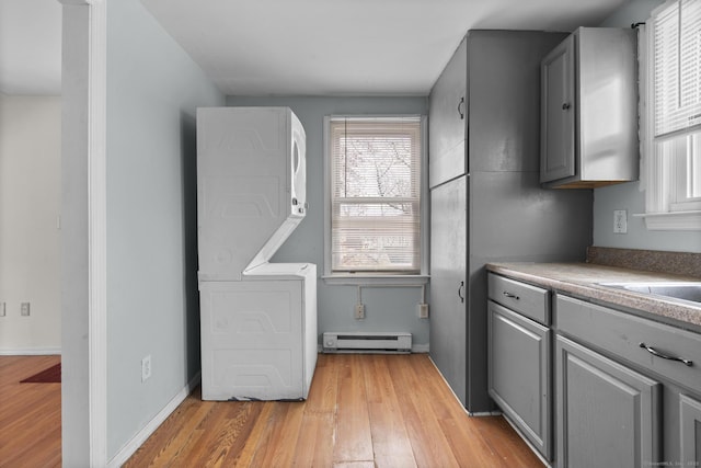 72 Maple St, Norwalk, CT 06850 - kitchen featuring gray cabinets, baseboard heating, and light wood finished floors