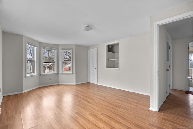 72 Maple St, Norwalk, CT 06850 - empty room featuring light wood-type flooring and built in shelves