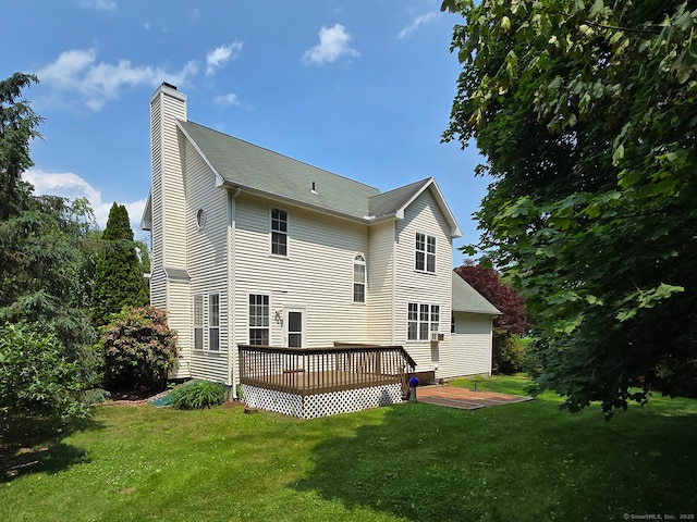 65 Ruby Ln, Stratford, CT 06614 - rear view of property featuring a chimney, a deck, and a yard