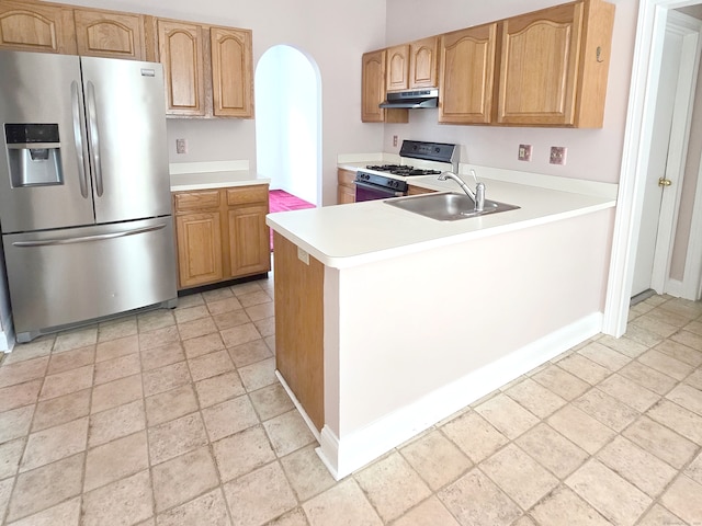 65 Ruby Ln, Stratford, CT 06614 - kitchen featuring stainless steel refrigerator with ice dispenser, gas range, stone tile flooring, under cabinet range hood, and light countertops