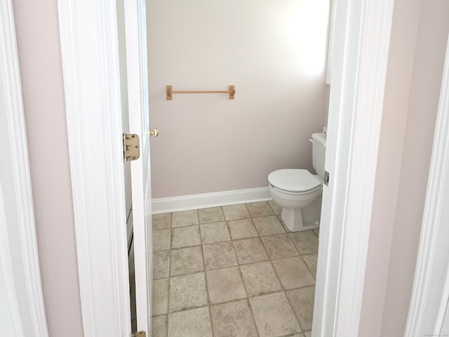 65 Ruby Ln, Stratford, CT 06614 - bathroom featuring toilet and stone finish floors