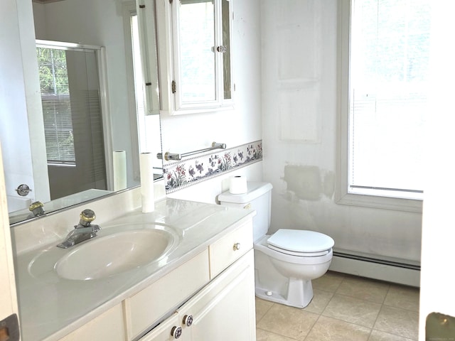 65 Ruby Ln, Stratford, CT 06614 - bathroom with a baseboard heating unit, vanity, and tile patterned floors