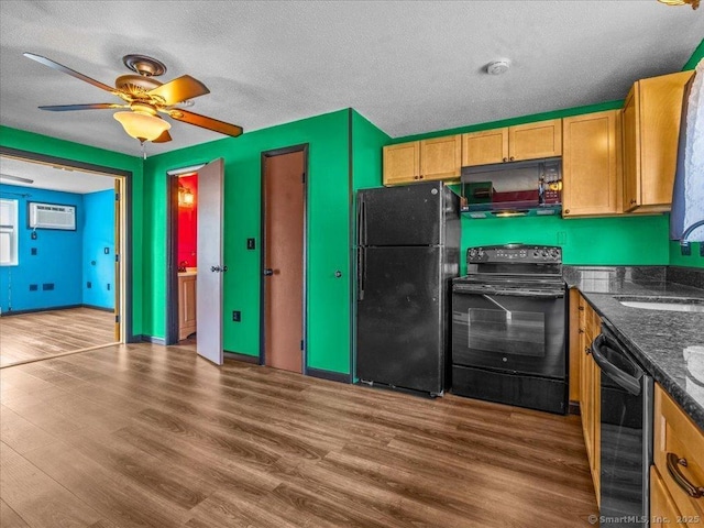 1081 New Haven Rd Apt 12F, Naugatuck, CT 06770 - kitchen featuring black appliances, a sink, wood finished floors, a wall mounted air conditioner, and a ceiling fan