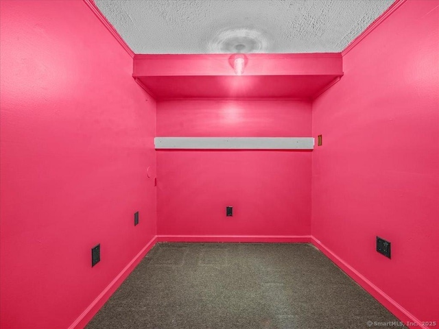 1081 New Haven Rd Apt 12F, Naugatuck, CT 06770 - spare room featuring dark carpet, a textured ceiling, ornamental molding, and baseboards