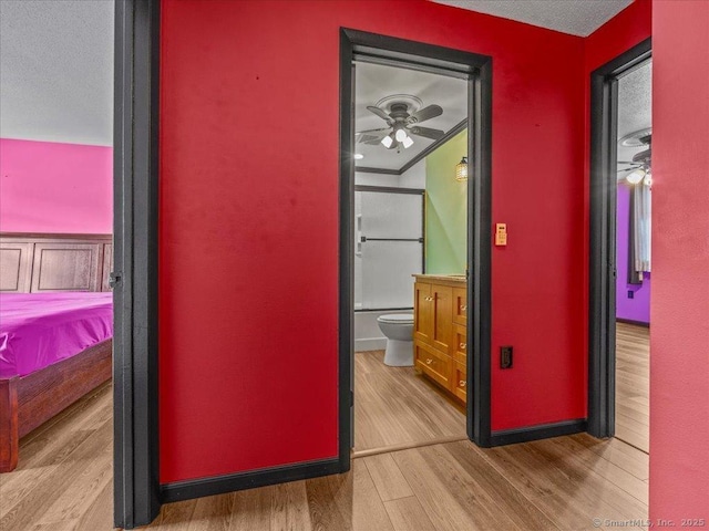1081 New Haven Rd Apt 12F, Naugatuck, CT 06770 - hallway with wood finished floors, a textured ceiling, and baseboards