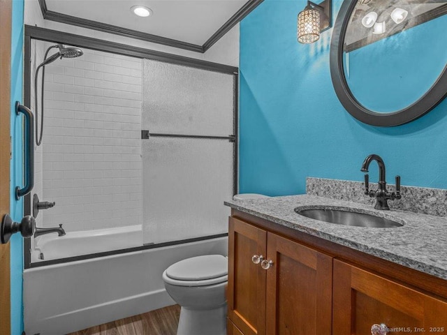 1081 New Haven Rd Apt 12F, Naugatuck, CT 06770 - full bathroom with toilet, vanity, ornamental molding, combined bath / shower with glass door, and wood finished floors