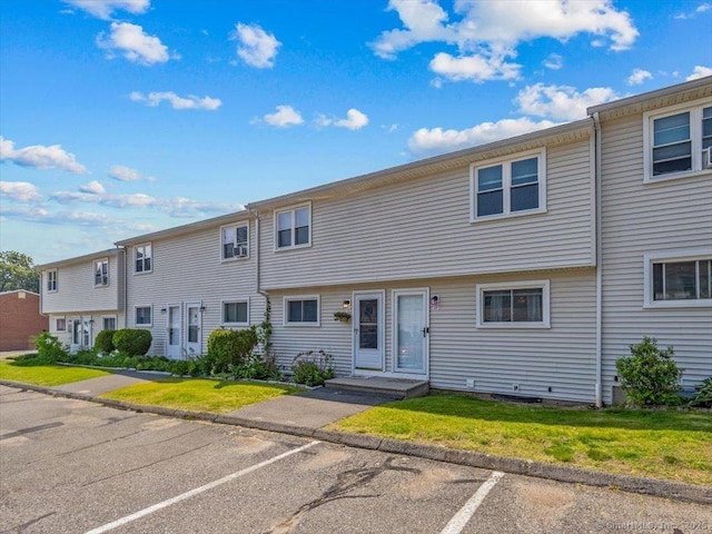1081 New Haven Rd Apt 12F, Naugatuck, CT 06770 - view of property featuring uncovered parking and a front lawn