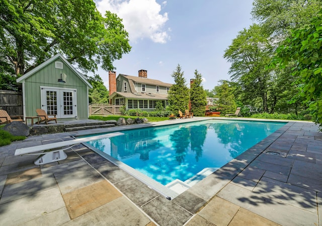171 Still Rd, West Hartford, CT 06117 - swimming pool featuring french doors, a patio area, and a diving board
