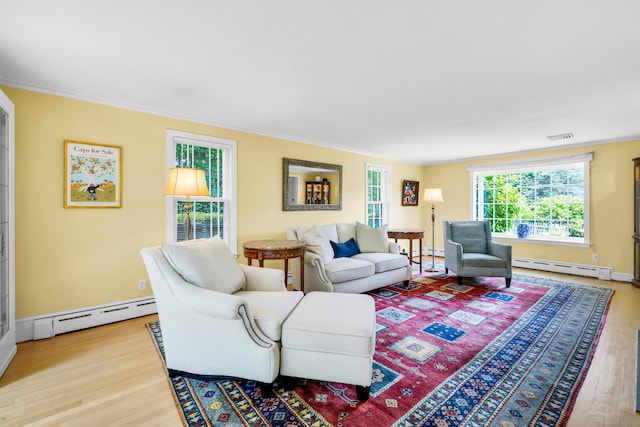 171 Still Rd, West Hartford, CT 06117 - living room with a baseboard radiator, wood finished floors, crown molding, and baseboard heating