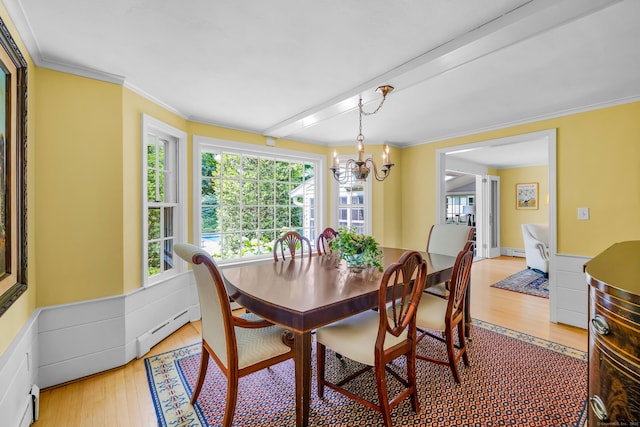 171 Still Rd, West Hartford, CT 06117 - dining room featuring light wood finished floors, a chandelier, plenty of natural light, and crown molding