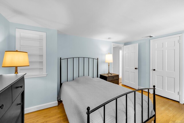 171 Still Rd, West Hartford, CT 06117 - bedroom with light wood-style floors and baseboards