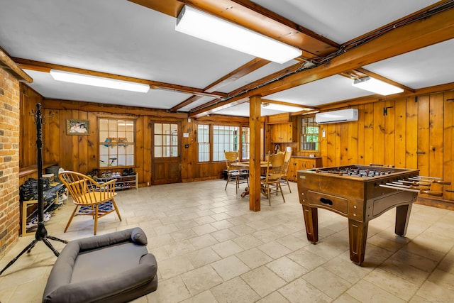 171 Still Rd, West Hartford, CT 06117 - game room featuring a wall unit AC, wood walls, and beamed ceiling