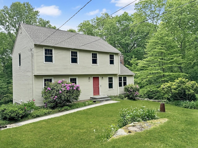 69 Huckleberry Ct, Guilford, CT 06437 - colonial-style house with roof with shingles and a front lawn