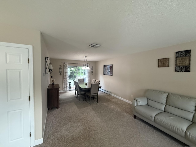 24 Podunk Cir Unit 24, South Windsor, CT 06074 - dining area with carpet and a baseboard heating unit
