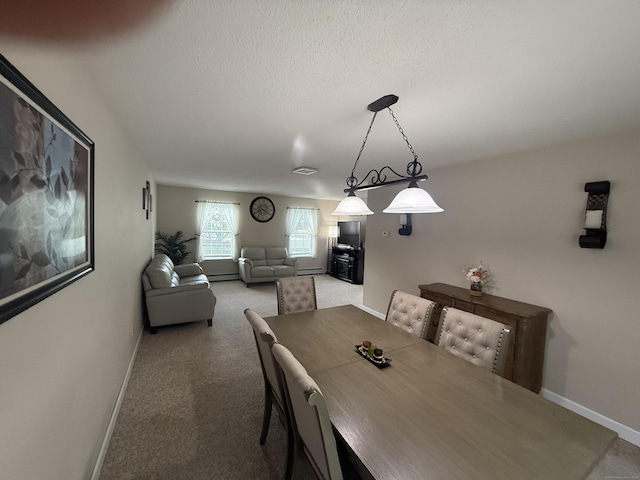 24 Podunk Cir Unit 24, South Windsor, CT 06074 - dining area featuring carpet and a textured ceiling