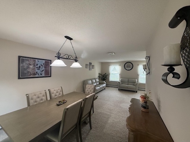 24 Podunk Cir Unit 24, South Windsor, CT 06074 - carpeted dining room featuring a textured ceiling and a baseboard heating unit