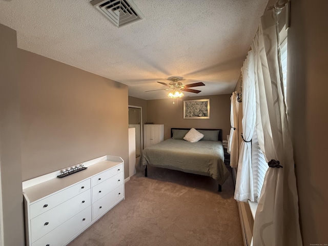 24 Podunk Cir Unit 24, South Windsor, CT 06074 - bedroom featuring light carpet, a textured ceiling, and ceiling fan