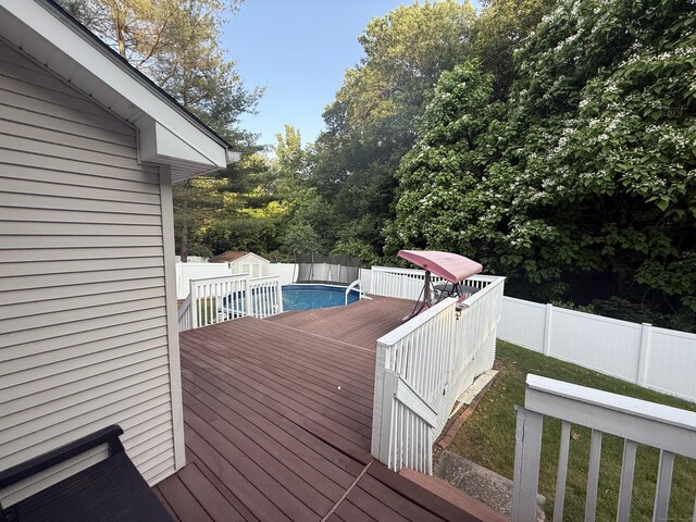 24 Podunk Cir Unit 24, South Windsor, CT 06074 - deck with a fenced backyard and a storage unit