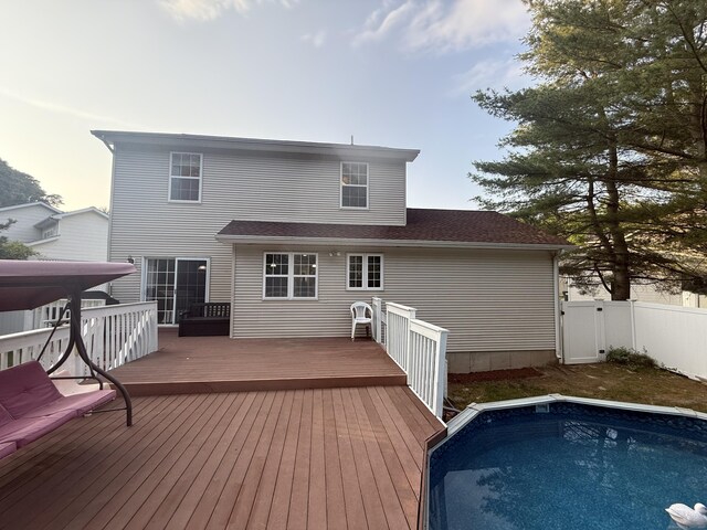 24 Podunk Cir Unit 24, South Windsor, CT 06074 - rear view of house with a deck and an outdoor pool
