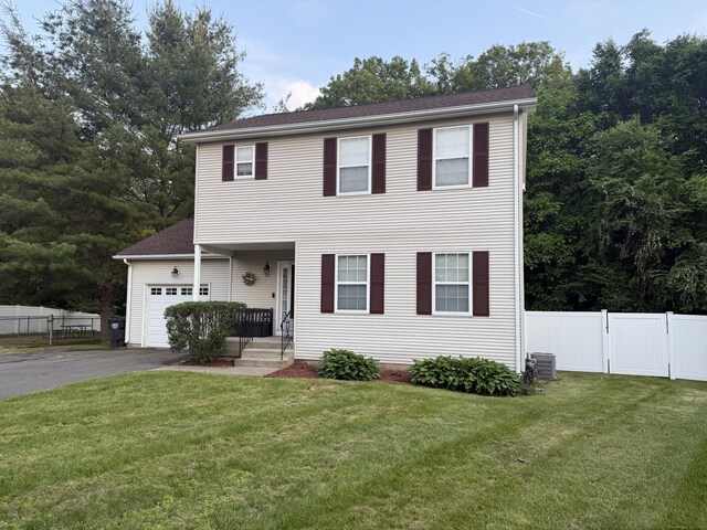 24 Podunk Cir Unit 24, South Windsor, CT 06074 - view of front of property with asphalt driveway and a garage