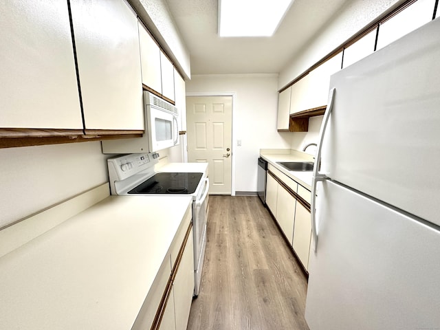 1 Concorde Way Unit B3, Windsor Locks, CT 06096 - kitchen featuring white appliances, white cabinetry, light wood-type flooring, and light countertops